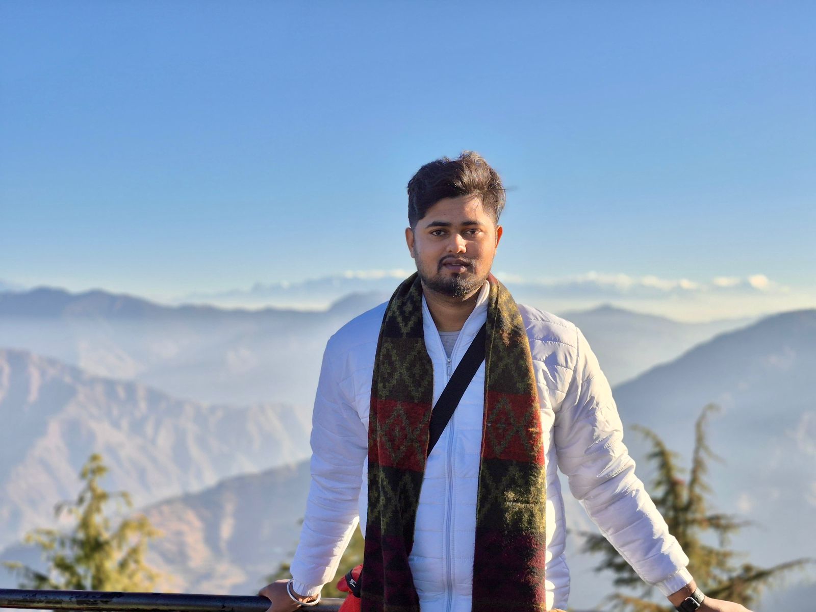 Niraj Aarya standing in the mountains