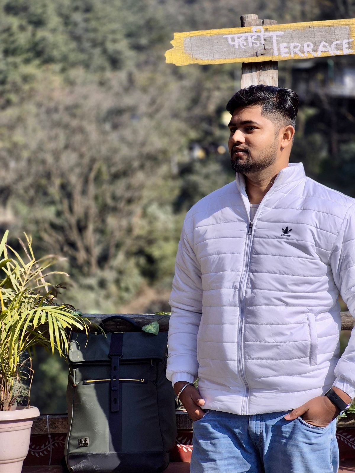 Niraj Aarya outdoors in a white jacket