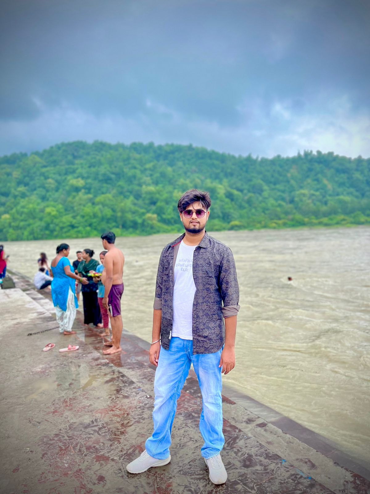 Niraj Aarya posing by the river