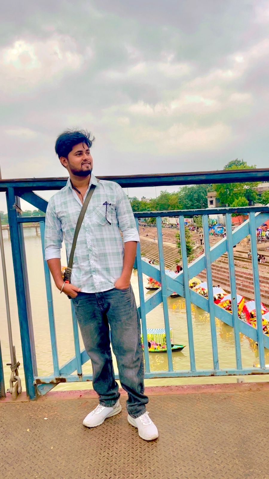 Niraj Aarya standing on a bridge